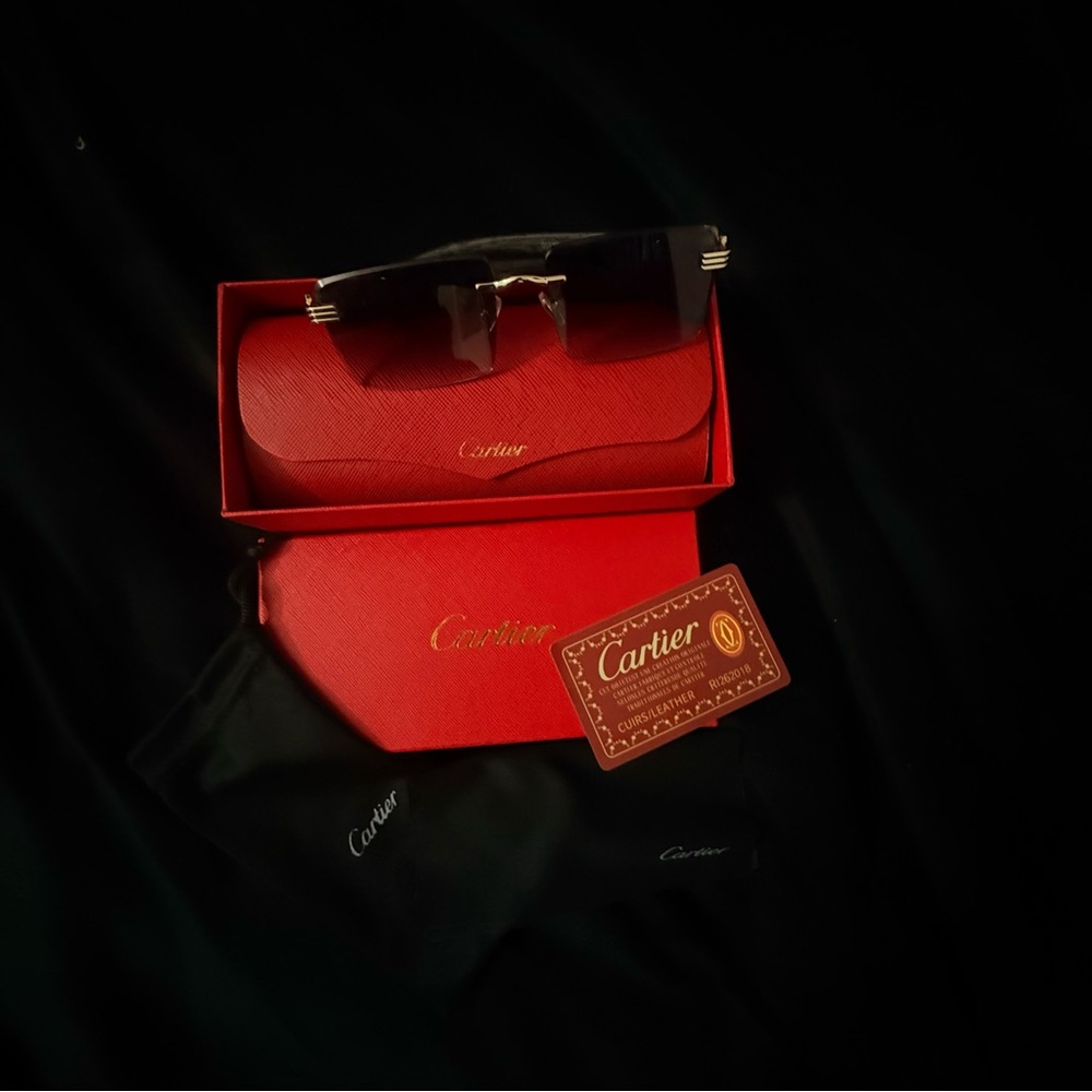 Cartier Men's Black and Gold Rimless Sunglasses